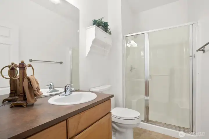 3/4 bathroom on main level adjacent to 6th bedroom / office.