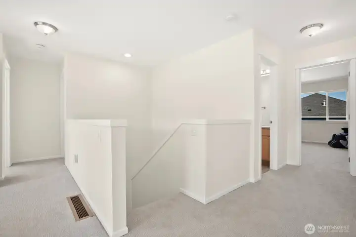 Upstairs view into main bedroom & 4 additional upstairs bedrooms.