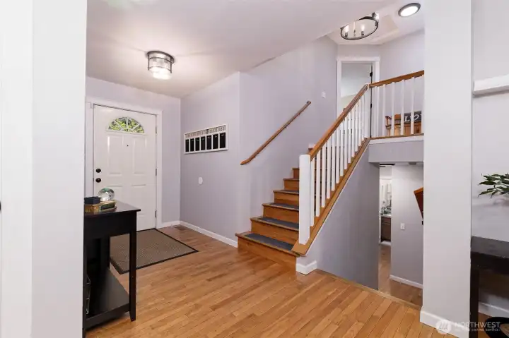 You come in to the main floor with the kitchen and dining area, utility room, and garage. Upstairs is a living room and the Primary bedroom and bath, and downstairs is a family room, two bedrooms, and a full bath.