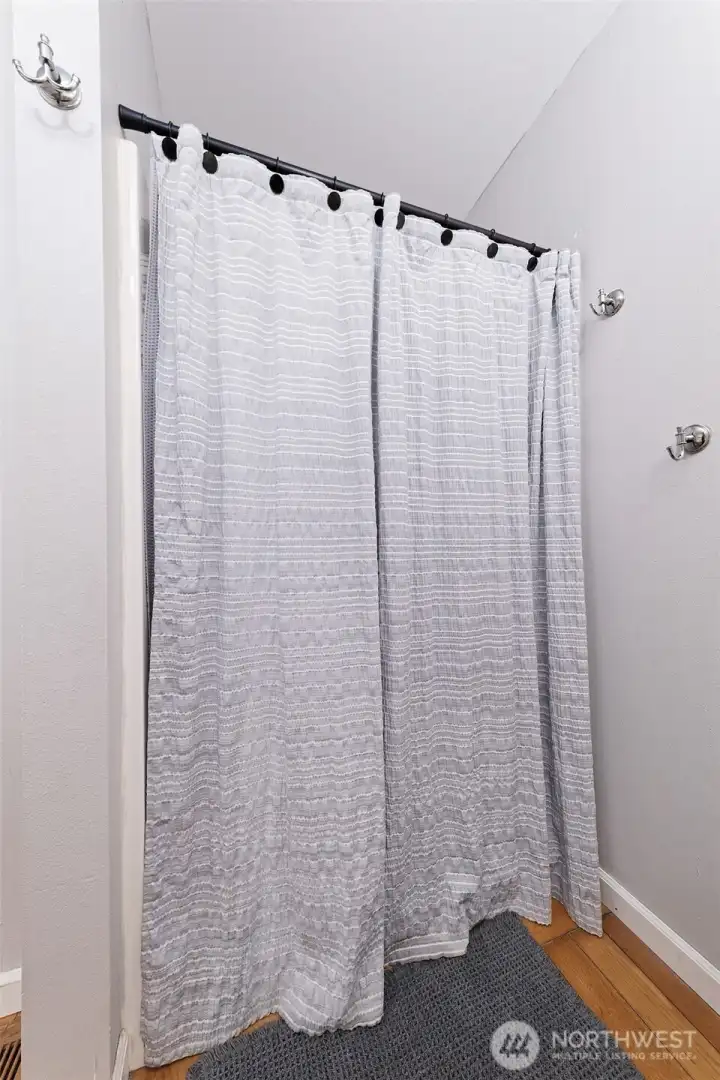 Upstairs primary bathroom step-in shower.