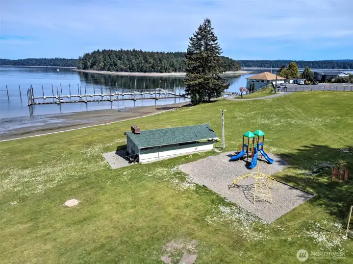 Carlyon Beach private community beach with play set and covered area.