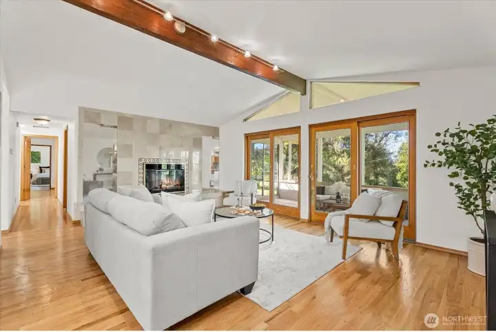 Gas insert fireplace is wrapped with floor to ceiling marble