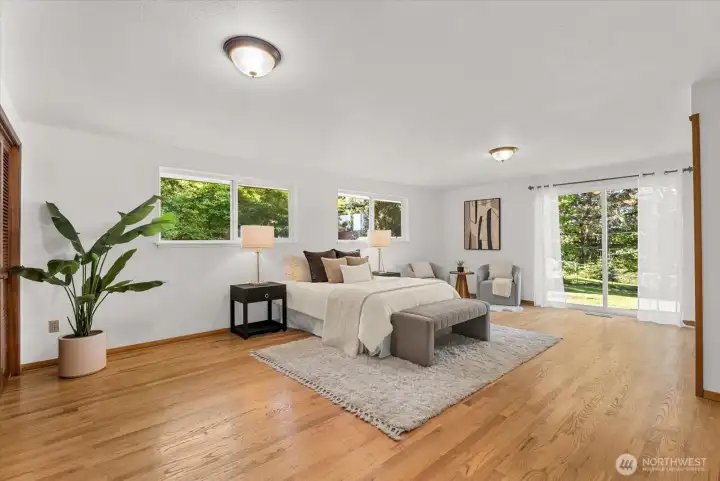 Primary Bedroom has a sliding glass door to outside backyard and lots of closet space