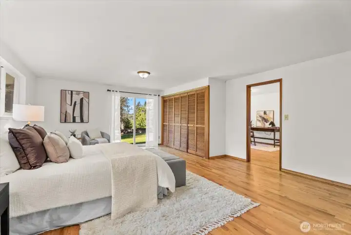 Primary Bedroom has a sliding glass door to outside backyard and lots of closet space