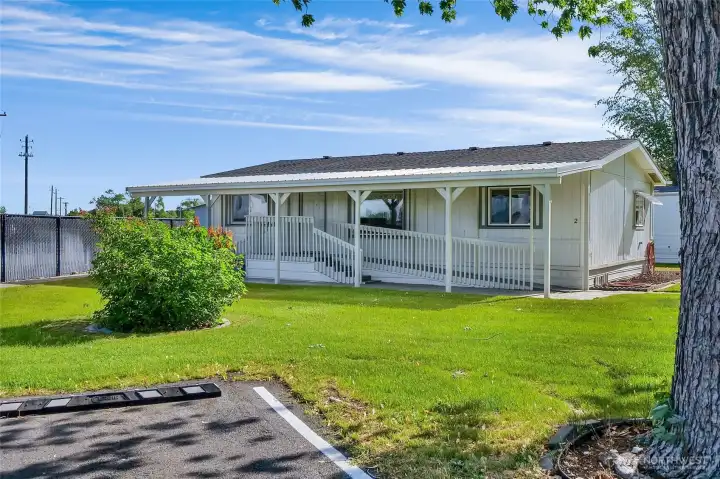 First beautiful double-wide home on the left when you enter the park.