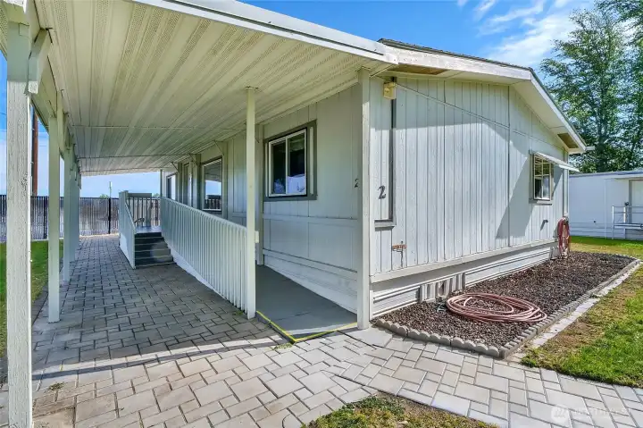 You'll love this shady area where the railings, posts, and porch have all just recently been painted.