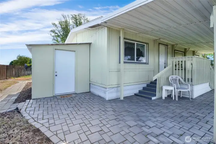 Ramp on the other side, and steps on this side of the porch, with easy access into the locked shed which, by the way, has power to it when you plug it in to the exterior outlet!