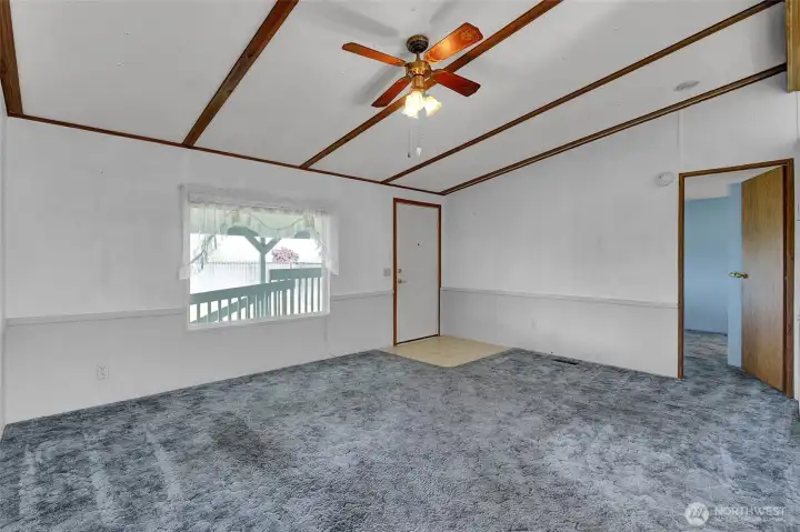 Another view of the living room and front door.