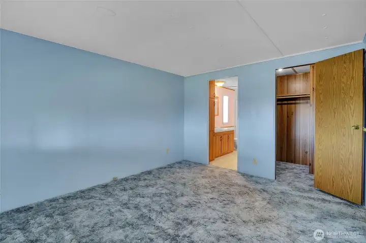 The walk-in bedroom has a walk-in closet. Reach right inside the door to your left and pull the string for the light to come on.