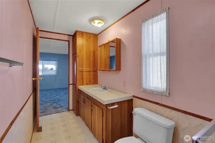 Looking back into the bedroom from the shower. That window faces the back yard.