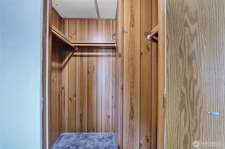 The primary bedroom closet.  Remember, pull the chain right inside to the left of the door to turn the light on.