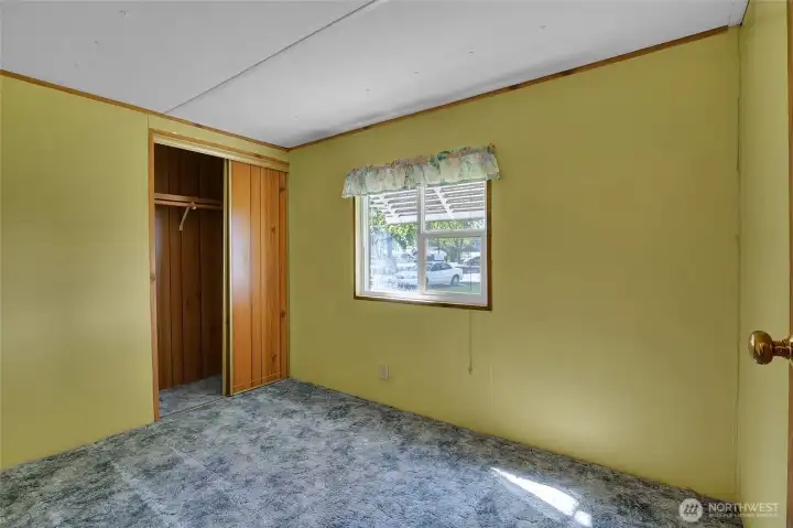 And our third bedroom, which has the same vinyl windows as the whole house, and this faces toward the front of the home, at the street.
