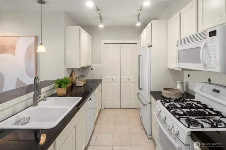 Black granite counters, white cabinets...a classic combination!