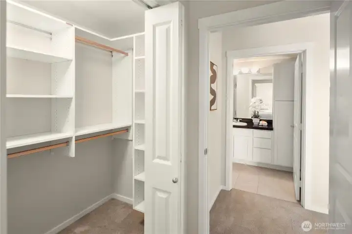 Closet space and across the hall is the bathroom serving the second bedroom.