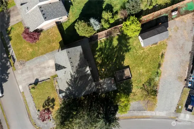 Aerial photo shows the enormity of this 1/2 acre corner lot. A separate entrance and additional parking.