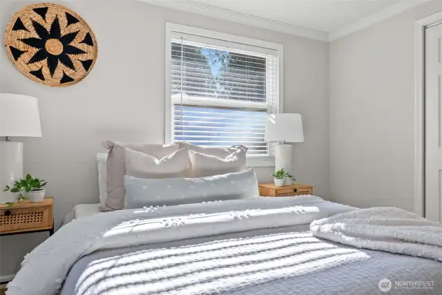 The spacious second bedroom comes with a ceiling fan for those warm summer days—though you’ll stay cool and comfortable with the AC that works like a charm!