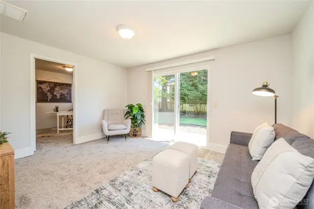The Family Room is the perfect place to relax, watch TV or play games. The slider opens to a concrete patio and the peaceful backyard.