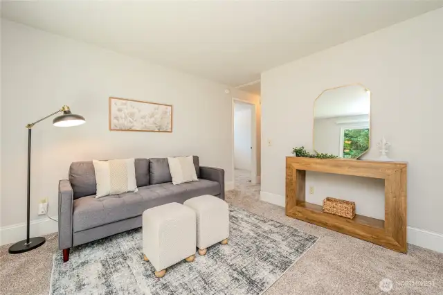 The doorway to the right of the sofa opens to Bedroom #1 with its own private 3/4 bathroom.