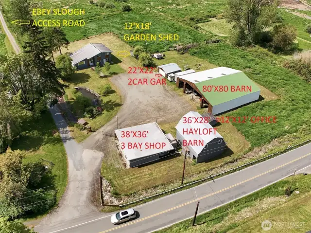 6 Outbldgs-2 barns, 2 car garage, 3 car shop with 4th bay on back, 2 barns, garden shed, 12x12 bldg used as office.