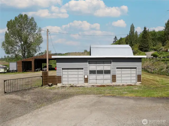 3 car/bays in front with another side bay for storage or equipment