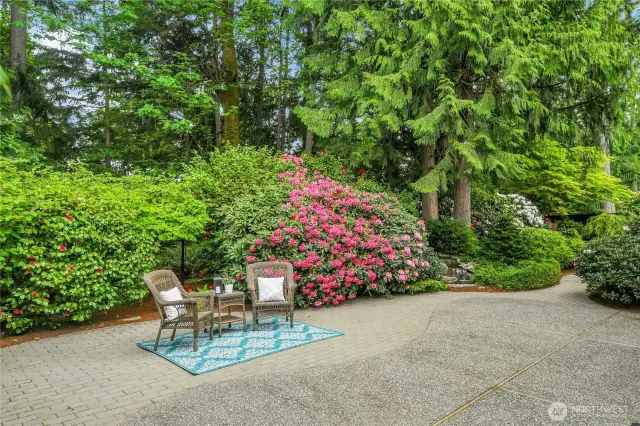 Large aggregate patio and bordered by pavers. Very private, fully-fenced Arboretum-style backyard, with wonderful water feature.