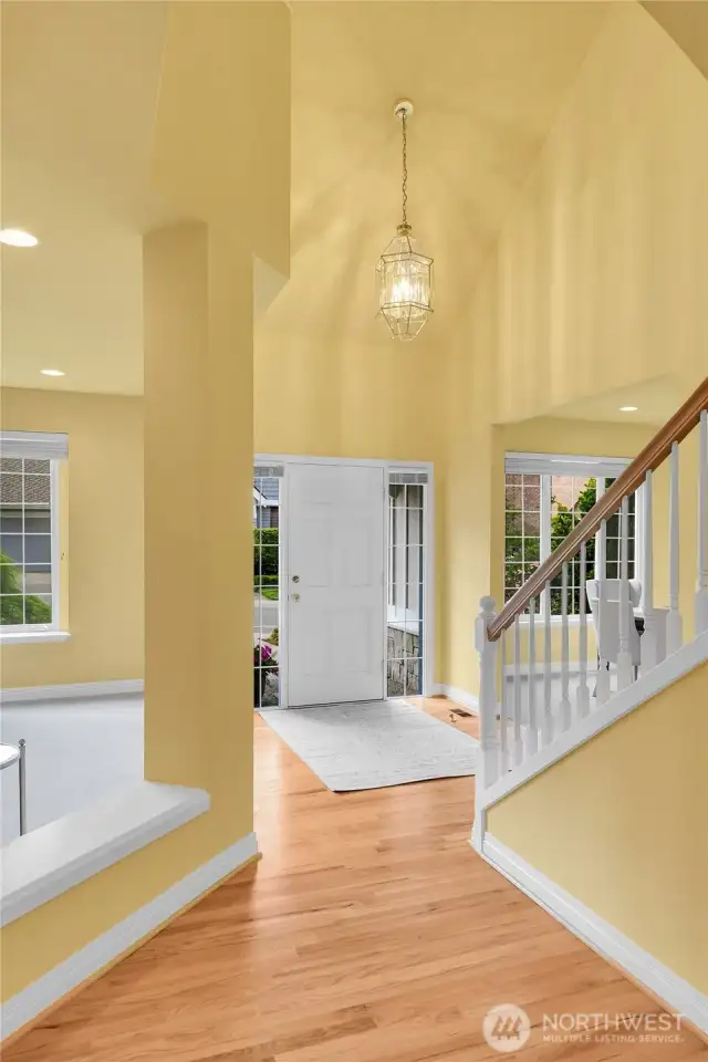 Magnificent foyer with soaring ceiling, polished-brass and beveled glass pendant chandelier. Oak-hardwood floor. Signature William Buchan millwork throughout. Entry hall with barrel-shaped passageway and entry coat closet with storage area behind.