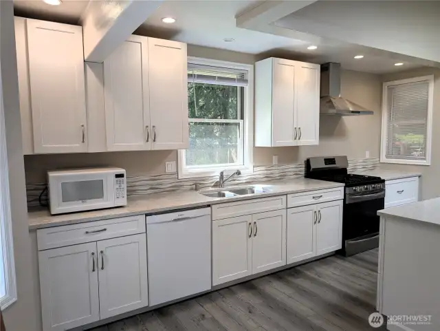 New kitchen with Quartz Counters. #2835 Cooper Point Rd NW, Olympia, WA 98502
