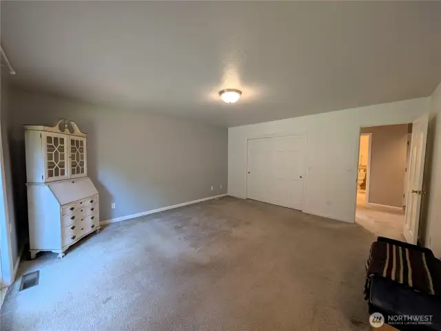 Primary Bedroom with 2 claosets. with door accessing the deck #2835 Cooper Point Rd NW, Olympia, WA 98502