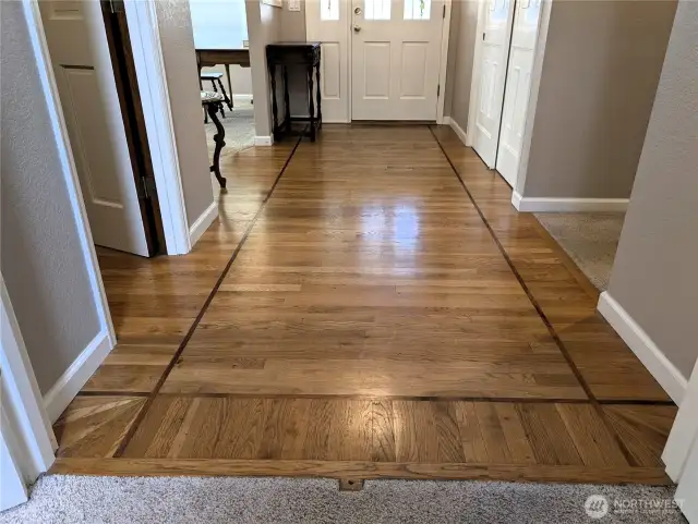 Oak hardwood flooring with Cherry inlaid borders. #2835 Cooper Point Rd NW, Olympia, WA 98502