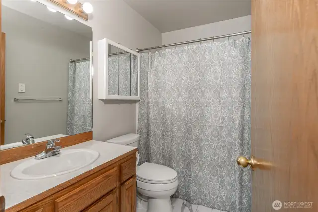 Hallway Bath Featuring a Tub/Shower Combo – Functional and Convenient for Household Members or Guests!