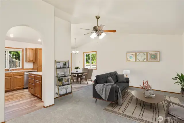 Spacious Open Floor Plan Seamlessly Connecting Kitchen, Dining & Living Areas – Ideal for Modern Living & Entertaining! Photo is virtually staged.