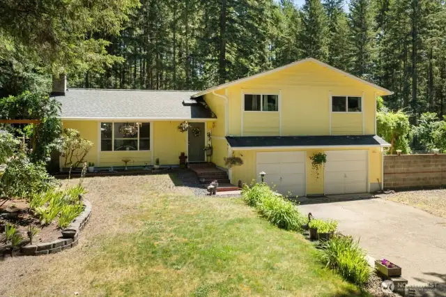 Tucked among the trees and open skies, this storybook home is ready to welcome you with space, charm, and quiet confidence.