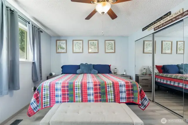 Spacious and serene, the primary bedroom offers a quiet escape with soft light and a calming layout.