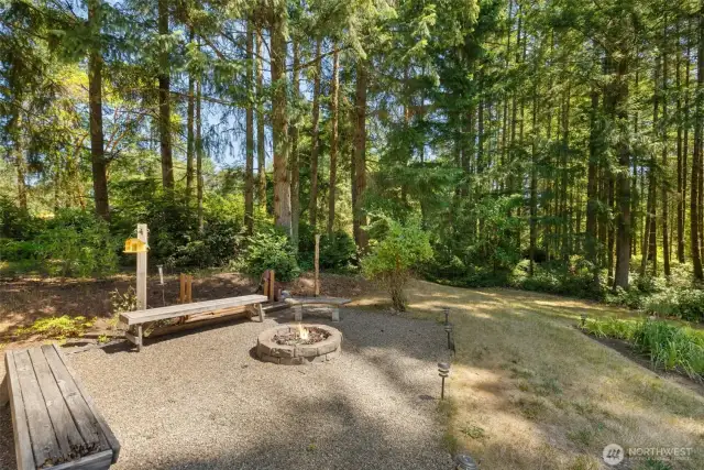 Tucked beside the patio, this built-in firepit adds year-round ambiance and a perfect spot to unwind outdoors.