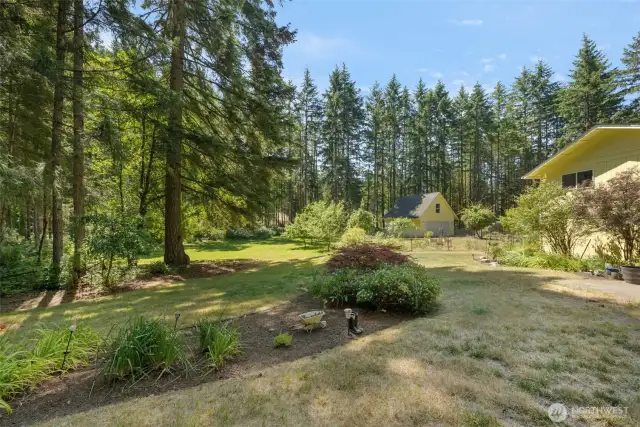From boundary to back shop, the land stretches out with purpose—level, usable, and lovingly tended.