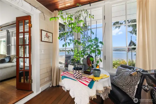 This sunroom off the living room would also make a perfect office space!