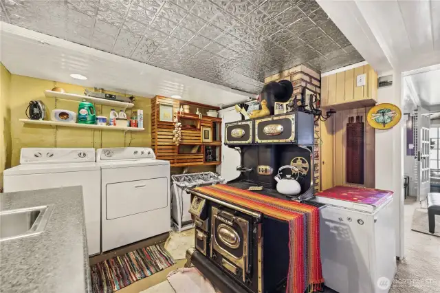 Lower level laundry area with this totally restored, fully functional antique cookstove!