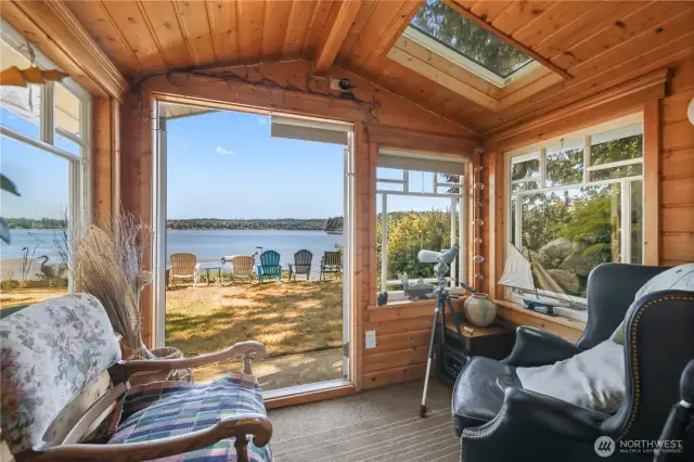 Small little nook from the lower level family room. French doors leading out to the yard. Picture yourself curled up on a chair with a good book and a cup of coffee watching the sunrise.