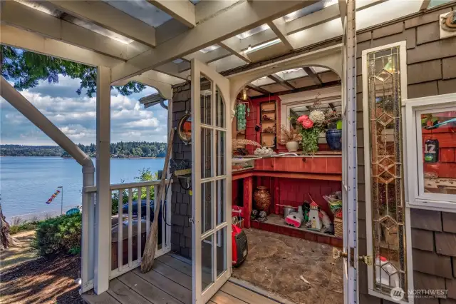 Charming greenhouse attached to the house, offering year round gardening just steps from your living space. Both a functional workplace and a peaceful retreat.