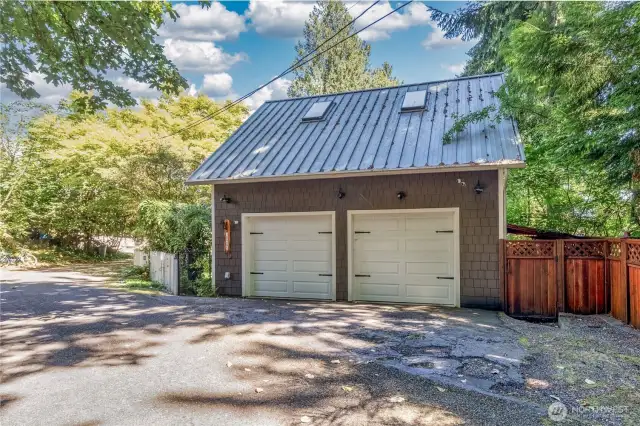 2 car garage with plenty of room for not only parking but has an area for a work bench and work area for all your tools.