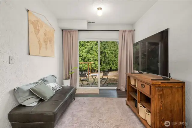 lower level living area with patio/ separate entrance to backyard