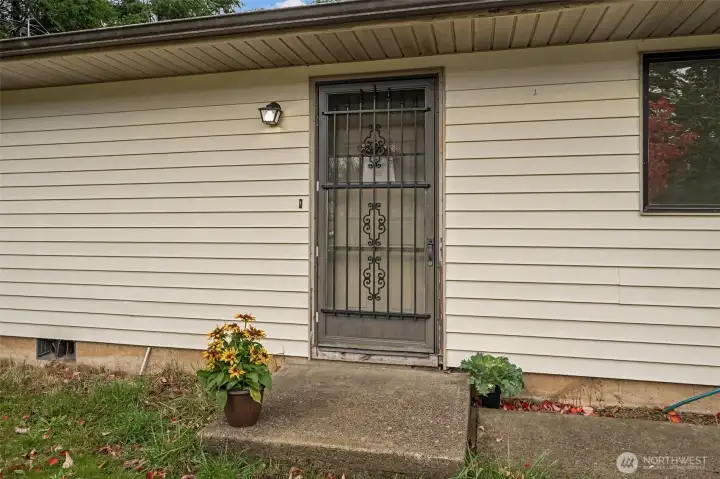 Easy care vinyl siding, and screen door for summer days plus a solid poured concrete foundation provide the practical start and leave an empty canvas for your garden, landscape or front porch creations.