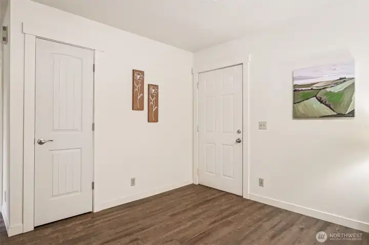 A high-value, quality door and white trim package, fresh and new wood-style laminate floors were just completed throughout the home. Note the brushed nickle toned lever door handles, another nice upgrade.