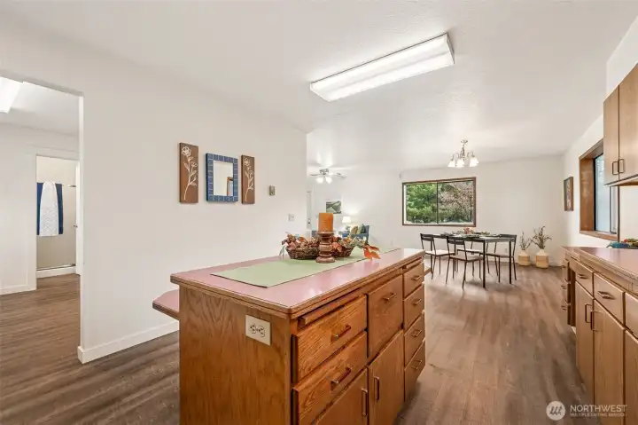 A huge kitchen island makes an excellent work triangle in the kitchen whether preparing daily meals, baking for the holidays or serving up a "game day" buffet.  Easy access to the huge utility room with extra pantry storage.