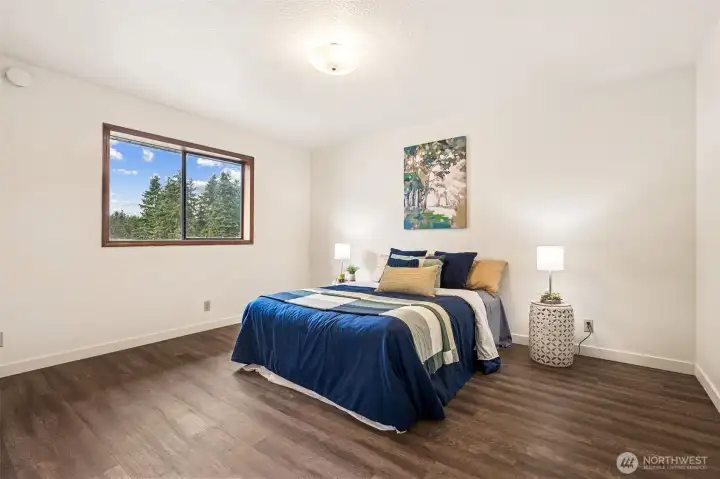 Discover a restful primary suite with 3/4 bath at the back corner of the home.  Find space for a King Size bed, or plenty of bedroom furnishings, even set up a bunk room in this generous space!