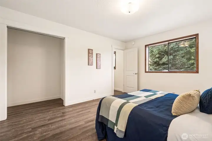 The door to the 3/4 pass-through bath offers night time privacy and a daytime short cut to the laundry room! The deep closet is waiting for your closet organizer.  Need more wardrobe space?  The utility room offers more!