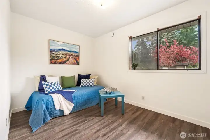 The second bedroom is a longer, good size space.  Shown here as a potential sofa/trundle arrangement to leave room for a desk under the window and to suggest a multi-functioning space.