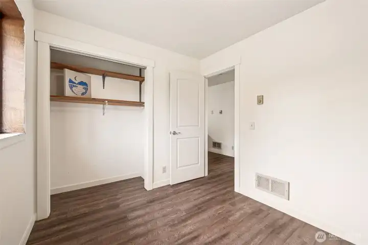 A good size closet in the second bedroom offers even more storage and wardrobe space.  The hall leads to the second bathroom, great room, and one entry to the primary bedroom.