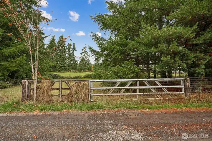 The side gate off Leak Drive access the pasture area in the middle of the 2.38 acre parcel.