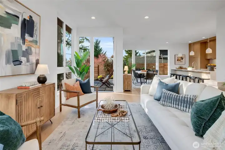 Light filled Living Room with door to outside patio.